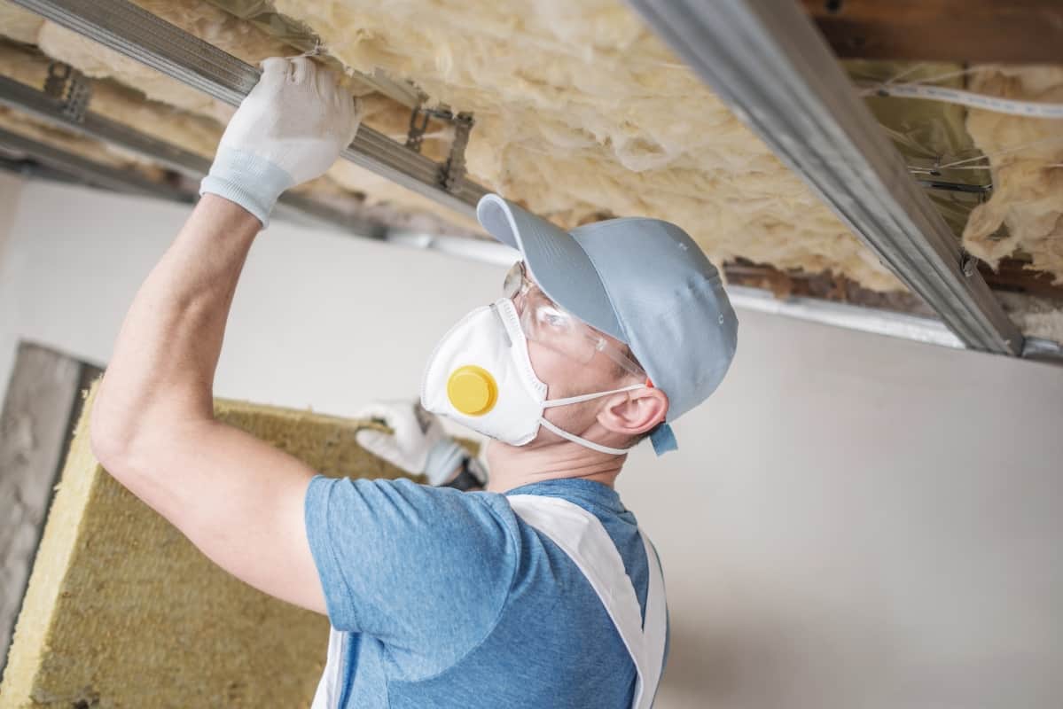 Man-repairing-the-attic